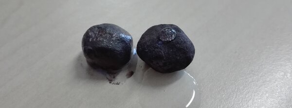 Treated and untreated iron ore pellets